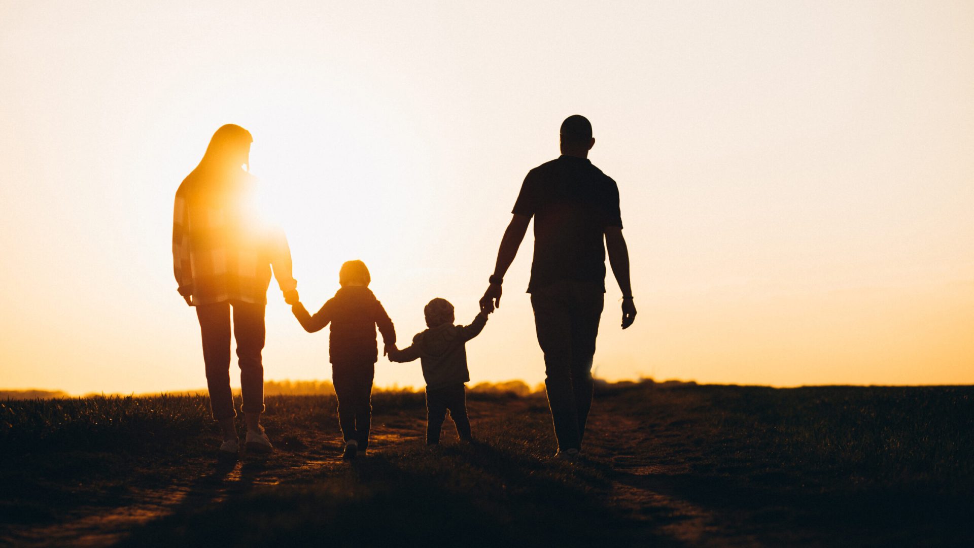 Happy family silhouette on the sunset